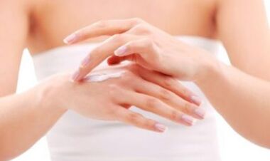 Girl applies ointment to her hand